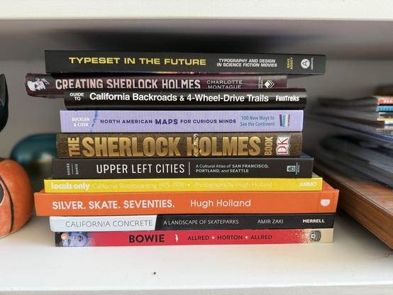 bookshelf photo with a stack of books