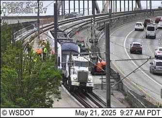 A 2 Line light rail train on I-90 near W. Mercer Way, also at 9:27am, on May 21st, 2025