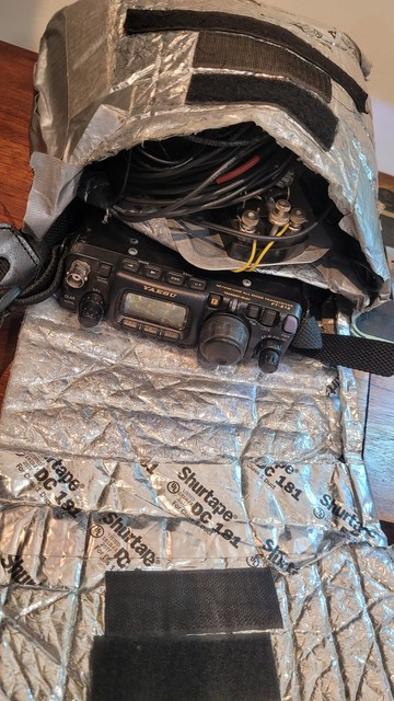 Radio in a bag made of duct tape and attic insulation. Also some stick on velcro