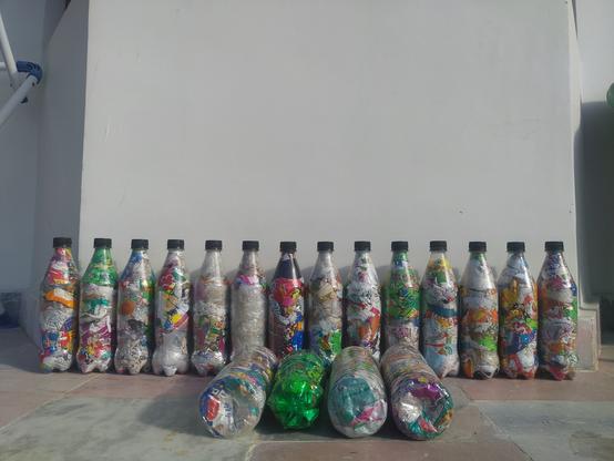 plastic bottles filled with plastic wrappers