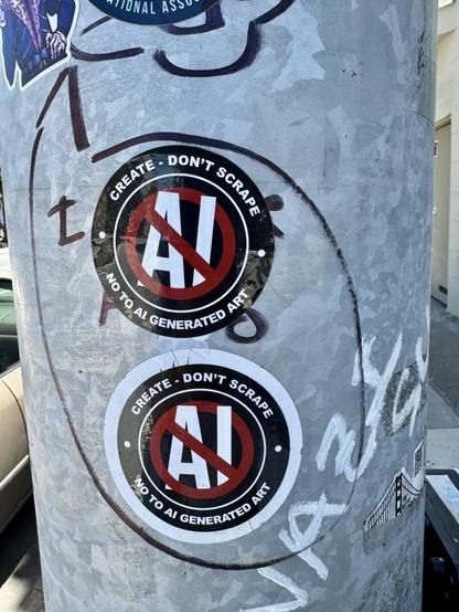 Two anti-AI stickers on a post. They say “create don’t scrape. No to generative AI”