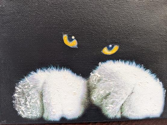 Black canvas with only two yellow cat eyes and two huge white paws