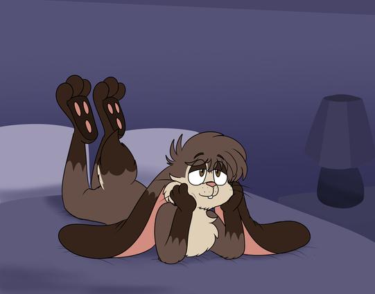 Mottio laying on the bed with his legs in the air. Looking up to the celling.