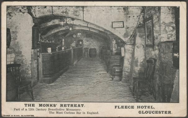 Printed monochrome postcard showing a view of the Monks' Retreat, a bar and part of a 12th century Benedictine monastery, in the Fleece Hotel in Gloucester, Gloucestershire.

Published by Nance & Bland, Gloucester, not numbered.

Postally used on 27 August 1912 with Gloucester cancellation on green halfpenny stamp and sent to Mrs Smith, 49 Dereham Road, Norwich.

Fairly good condition, with some corner bumps, but small creases to three corners.