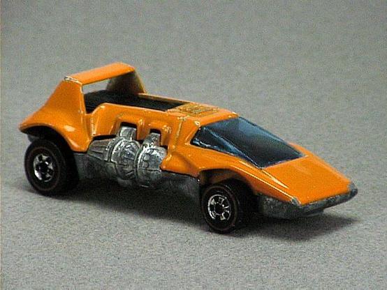 Released in 1973, Fluorescent Lime Green Double Header of 1973 Hot Wheels with Redline wheels. Notes: Has one metal engine on each side of car. Packaging: 1973 Blister. Metal Body, Metal Base. Made in Hong Kong. Scarcity: 9/10