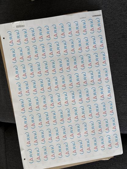 A3 sticker sheet, with « (Ark) » being colored using the trans flag theme and a bit of yellow.
There is a radial gradient on the A, using white, yellow, pink and blue.
