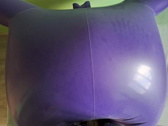 Inflated purple inflatable latex suit from top