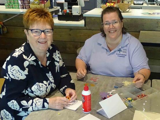 Social group member Angela Pridmore with volunteer Alison McNamara.