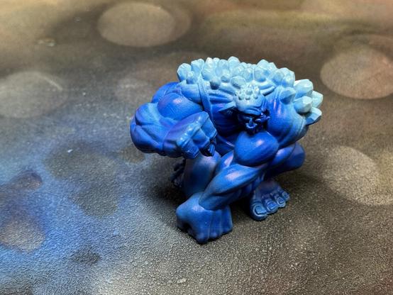 The troll from the slightly above with brightened crystals on his back.