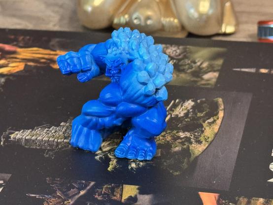 The troll from the front with brightened crystals on his back after the paints cured over night. It went a little darker.