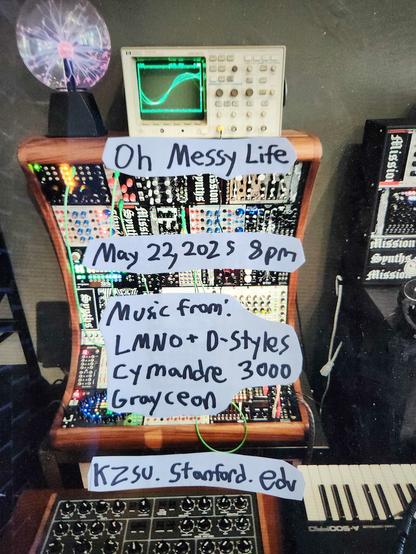 A flier for the Oh Messy Life radio program consisting of handwritten text on top of a photograph of rows and rows of analog synth equipment in a rack on top of which is an osiliscope and a glass ball of lightning.