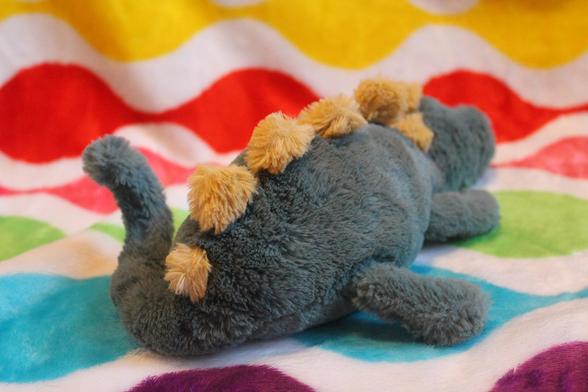 The backside of the dinosaur plush