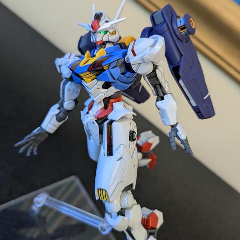 The HG Gundam Aerial (with upside down heels, whoops) on a stand as if flying with the Mirasoul attached.