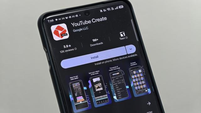 Phone with the youtube create beta app install page from the google play app store.