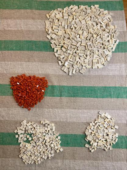 Loooots of tiiiiiny bricks. Lovely 1x2 red ones that appear to be one (and from the 70s!). White 2x2/3/4 that have yellowed