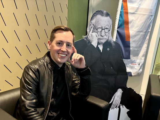 Paris with a cardboard cutout of Joseph Weizenbaum
