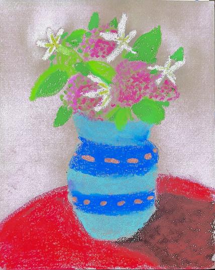 Oil pastel of a light blue and dark blue striped vace. It is sitting on a red table with a shadow coming off of the bottom, right hand side in the vase are what appear to be clusters of pink flowers and larger star shaped white blossoms with yellow centers. These are surrounded by various bits of greenery, the whole piece is set on a tan or light brown backdrop