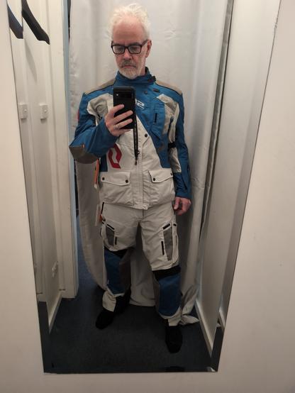 A man wearing a motorcycle adventure suit