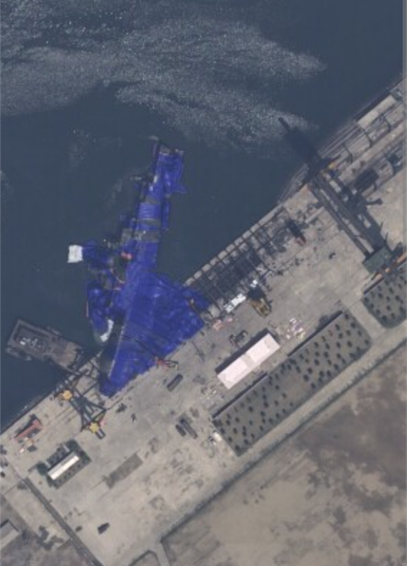 Satellite image of the wreckage resulting from North Korea's inadvertent success in making the peninsula a little safer. The launch was a partial success - some of it is wet, at least. Blue tarpaulin has been deployed, not entirely successfully, to cover the wreckage from people who might otherwise laugh at it. That's not worked either. 

Of note, an obvious break in the lines of the ship suggest it's actually ripped itself open as it went.