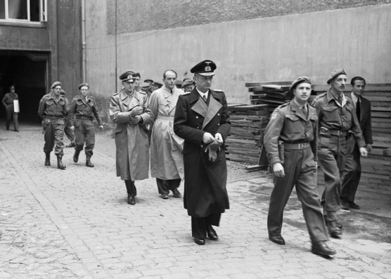 Dönitz (center), Jodl and Speer being presented to the press at police headquarters Flensburg. Source: Wikipedia / WikiCommons, license: copyright run out.
