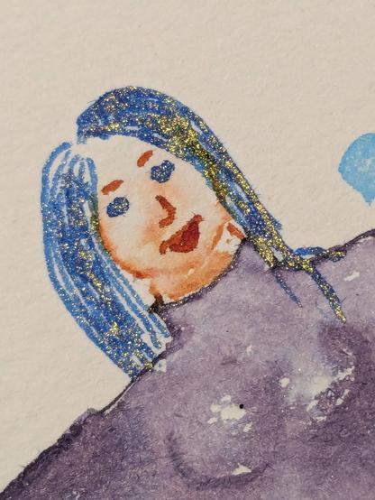 Close up of Mermaid face showing very sparkly gold hair.