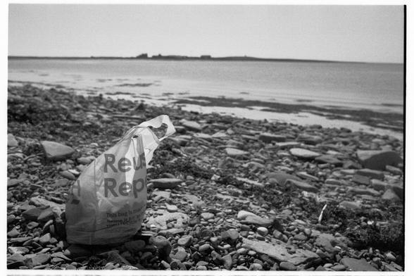 A Tesco carrier back on a small beach