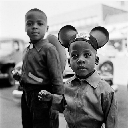 New York based nanny, making photos in her free hours  in New York and Chicago in the 1950 's.
This photo shows two young boys, one of them wearing Micky Mouse ears.