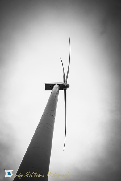 Looking up the mast of a windmill.