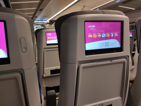 Picture from a train seat, every seat has an 'in-train-entertainment' screen, looks like what you'd expect from a plane