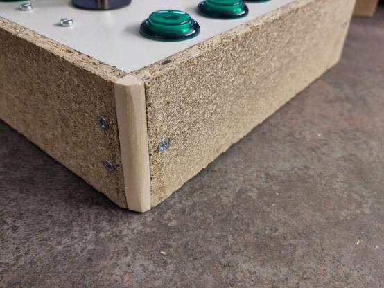 Detail of the arcade controller with rounded dowels for corners