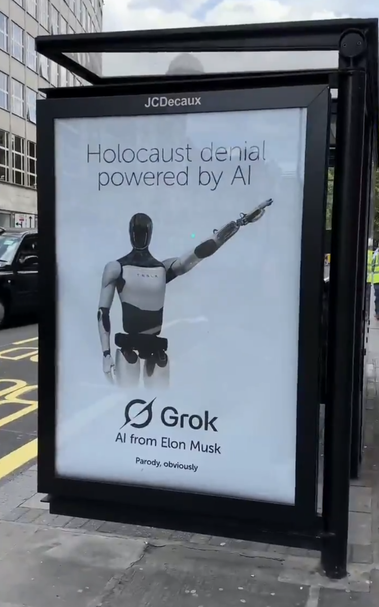 Poster on a London Bus Shelter.
A nazi saluting Tesla Optimus robot.
Text reads 'Holicaust denial powered by AI. Grok AI from Elon Musk.