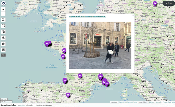 - Carte interactive OpenStreetMap avec icônes violettes de marqueurs  
- Popup centré montrant une photo de supermarché  
- Panneau de contrôles de zoom et d’édition à gauche  
- Légende et options en bas