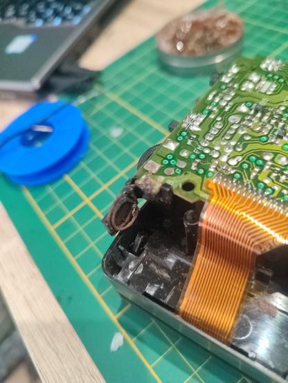 rusted battery pin inside a cassette player