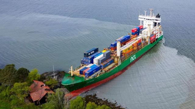 Container ship run aground next to someone’s home