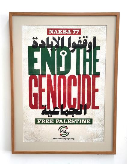 A placard from the Nakba 77 Palestine march. 

"End the Genocide" is the main message