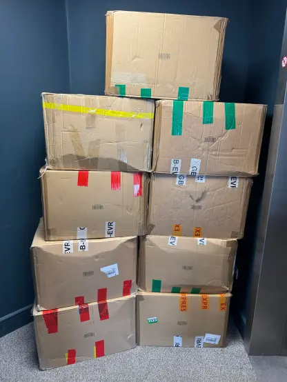 Seven large cardboard boxes