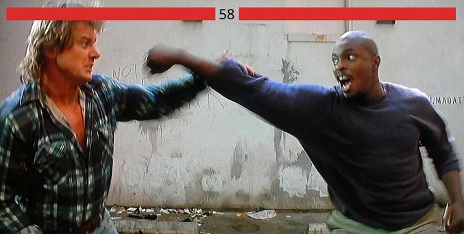 the fight scene from They Live where Nada is trying to convince Frank to try on the Hoffman lenses but they end up in this huge brawl in an alley