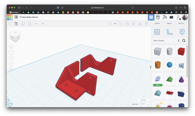 A Tinkercad screenshot of two, red TT gear motor mounts.