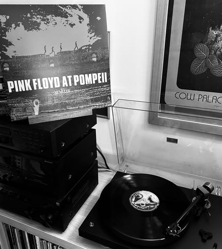 Pink Floyd at Pompeii in the ‘Now Playing’ stand next to the turntable with the record in full spin.