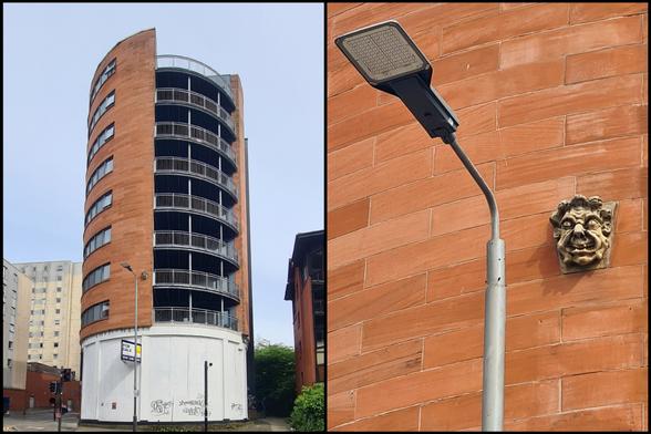 A keystone grotesque incorporated into a modern building.