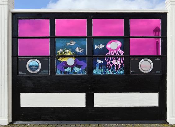 Photo of one of 200+ windbreak panels on the pier which have been decorated as part of a project organised by Creative Waves Community Arts. Worthing, West Sussex, UK.