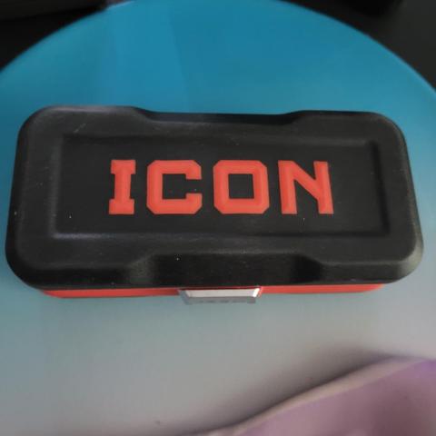Closed rubberized box of an ICON Locking Flex-Head Ratchet and Bit Set from Harbor Freight. Box is black with raised red 'ICON' letters.