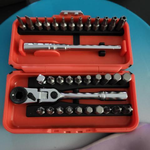 Open case of an ICON locking Flex-Head Ratchet and bit set showing all 35 pieces within the red case, held in by black rubber holders.