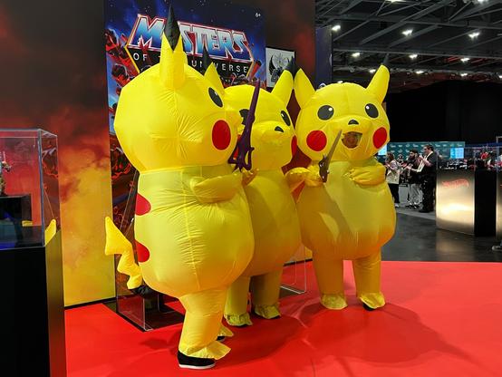 3 people in large inflatable Pikachu costumes