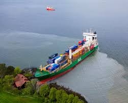 Overhead shot of large container ship crashed into bay near house in Norway