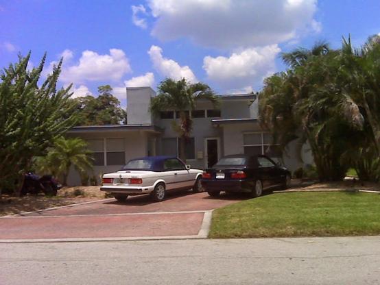 The glory days of owning 2 old BMW convertibles at the same time. My white E30 is parked in our Fort Lauderdale driveway next to the Orient Blue E46.