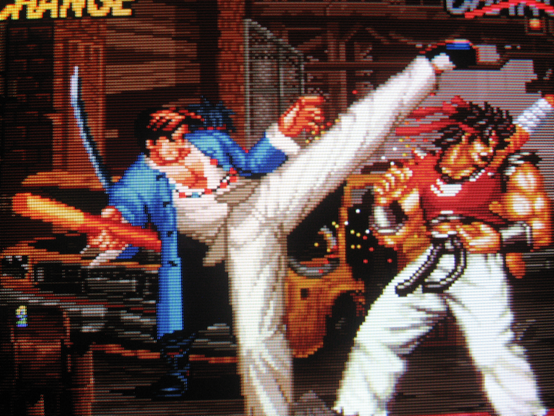 Kim Sue-Il high-kicks Sho Hayate upside the head.