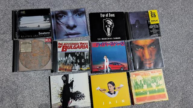 A photo of CDs on a floor with these being by the following :
Smetana, Emiliana Torrini, Dur et Doux, Mercury Rev
Gregorian & Orthodox Chant, The Mysterious Voices of Bulgaria, Beck, Tricky
Antoni Maiovvi, Jain, Sun Araw & M. Geddes Gengras meet The Congos