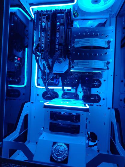 A dark room photo of my new PC build Odin showing off the ARGB lights inside the PC