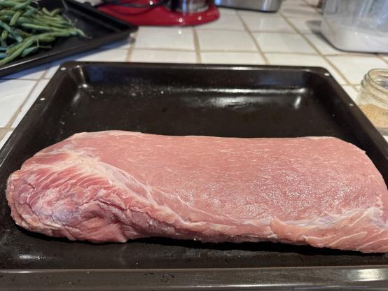A pork loin over four pounds, drying surface and tempering up to room temp.